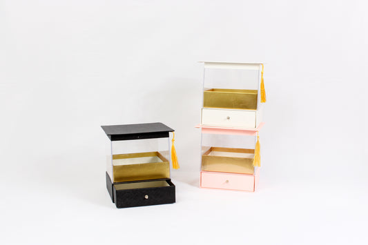 Acrylic display box with drawer and tassel, luxury gift packaging for flowers or desserts.