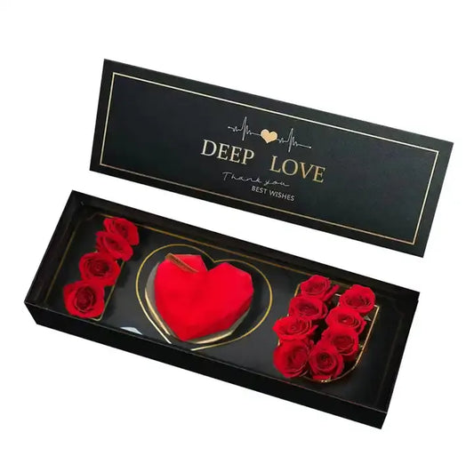 Foldable “I Love You” gift box with clear lid and red roses inside.