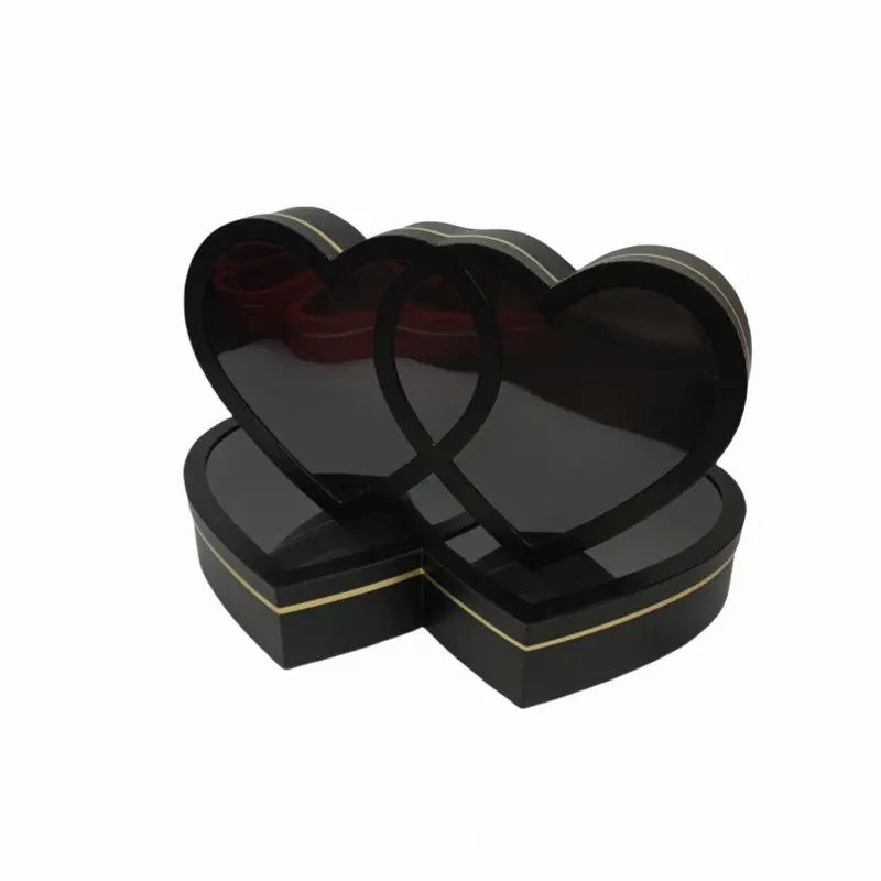Black double heart-shaped gift box with transparent lid for flowers and gifts.