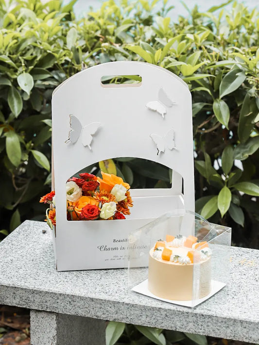 White butterfly cut-out cake box with handle, elegant packaging for desserts and pastries