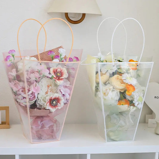Transparent PVC flower bag with handles, available in pink, black, and white.