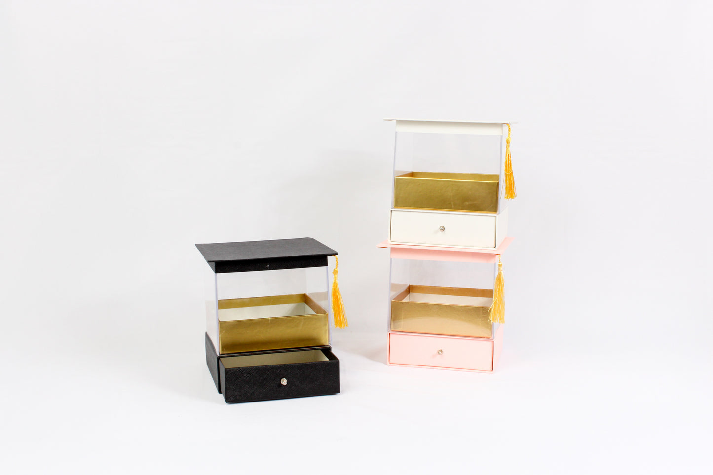 Acrylic display box with drawer and tassel, luxury gift packaging for flowers or desserts.