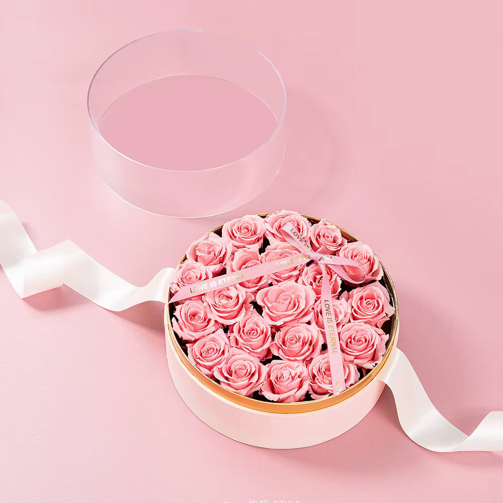 Pink round acrylic flower box with ribbon closure