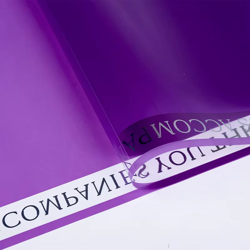 Plastic gift wrapping paper with printed ribbon accent