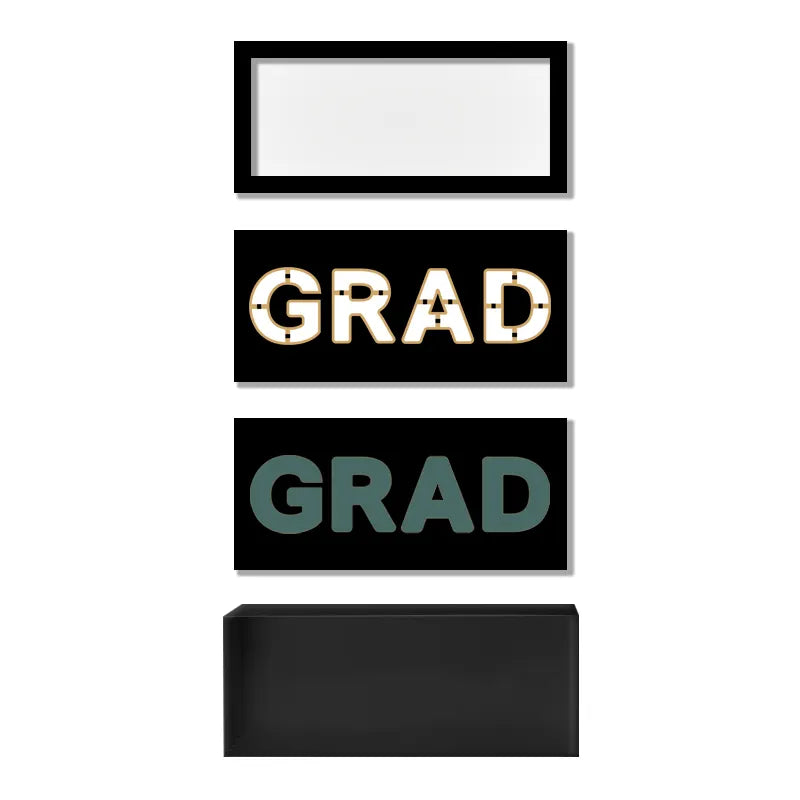 Elegant graduation gift box in black with clear top and gold-accented GRAD letters.