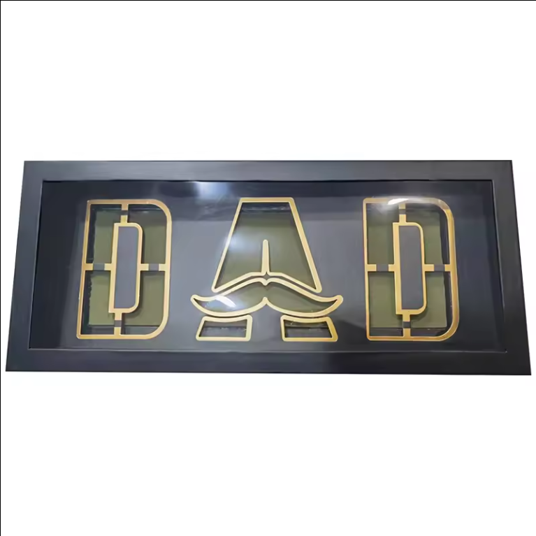 Foldable black DAD box with clear lid and gold outline letters.