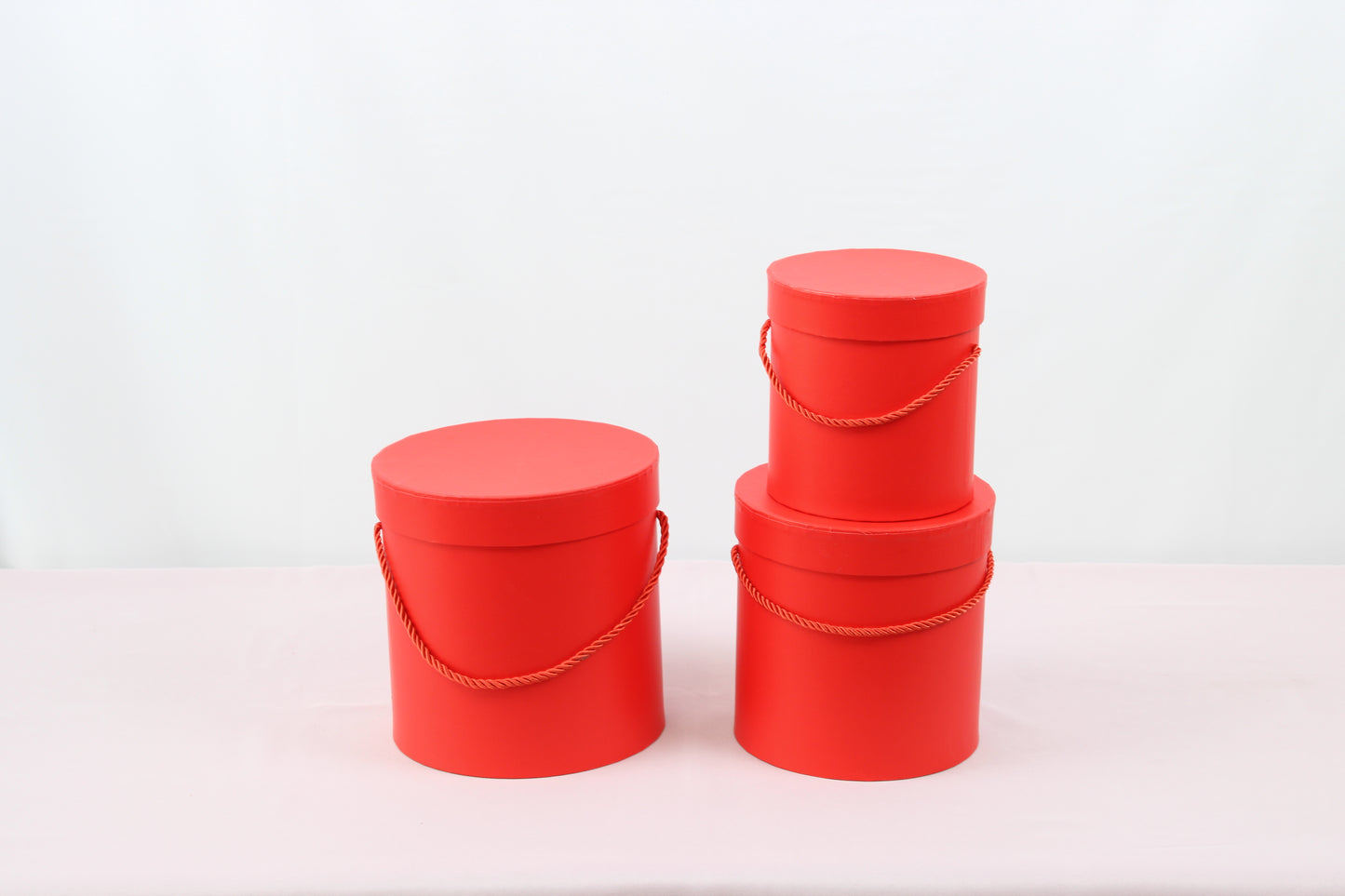 Close-up of Red Round Hat Box for flower bouquets and chocolate strawberries.