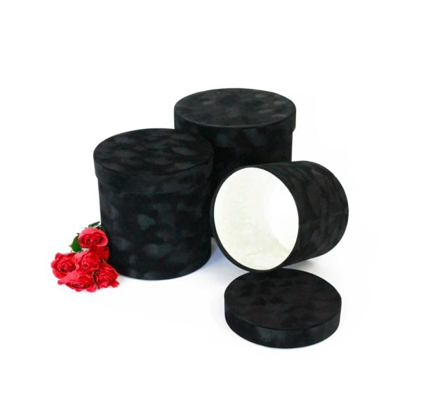 Black velvet round Flower Box for elegant floral arrangements.